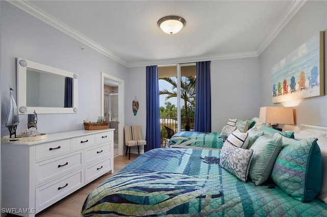4761 W Bay Blvd Unit 303, Estero, FL 33928 - bedroom with crown molding, wood finished floors, and ensuite bathroom
