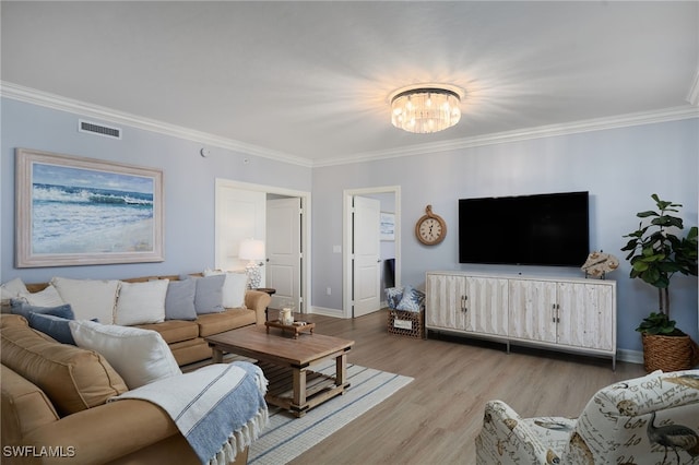 4761 W Bay Blvd Unit 303, Estero, FL 33928 - living area with a chandelier, crown molding, wood finished floors, and baseboards