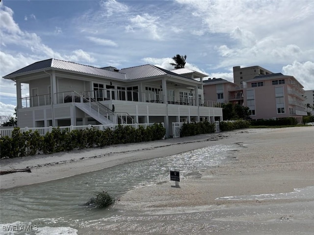 4761 W Bay Blvd Unit 303, Estero, FL 33928 - back of property featuring a standing seam roof and metal roof