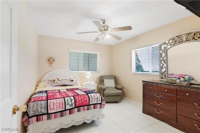bedroom featuring light tile patterned floors and ceiling fan