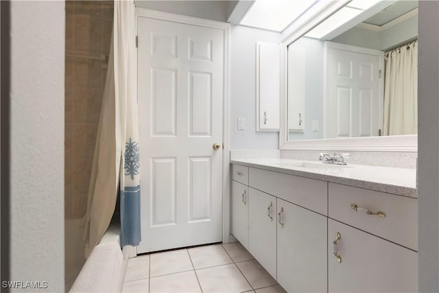 full bath with vanity, tile patterned floors, and shower / tub combo with curtain
