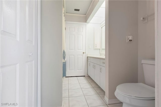 bathroom with visible vents, ornamental molding, vanity, toilet, and tile patterned floors