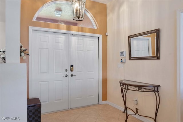212 SE 30th Ter, Cape Coral, FL 33904 - foyer featuring light tile patterned floors and baseboards