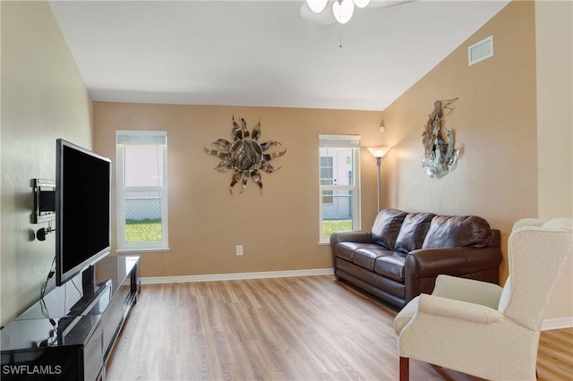 212 SE 30th Ter, Cape Coral, FL 33904 - living area with wood finished floors, ceiling fan, and baseboards