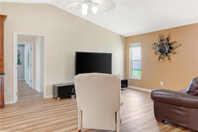 212 SE 30th Ter, Cape Coral, FL 33904 - living room with light wood-style flooring, ceiling fan, vaulted ceiling, and baseboards