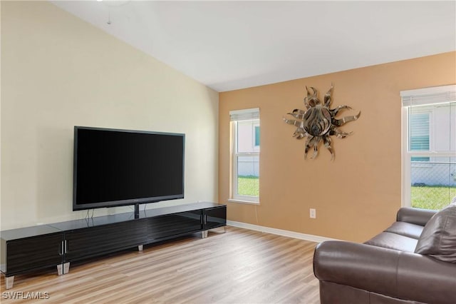 212 SE 30th Ter, Cape Coral, FL 33904 - living room with light wood-style floors, healthy amount of natural light, and baseboards