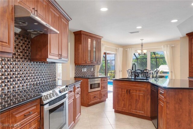212 SE 30th Ter, Cape Coral, FL 33904 - kitchen featuring electric stove, under cabinet range hood, a sink, a chandelier, and black dishwasher