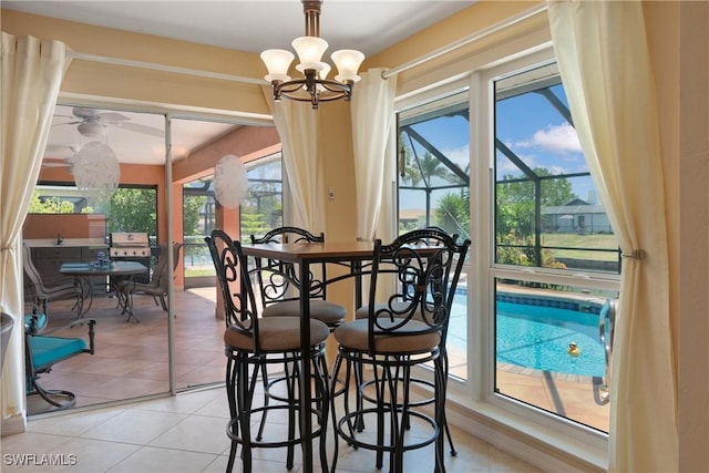212 SE 30th Ter, Cape Coral, FL 33904 - dining area with a chandelier and light tile patterned floors