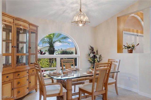 212 SE 30th Ter, Cape Coral, FL 33904 - dining room with a chandelier and light tile patterned floors