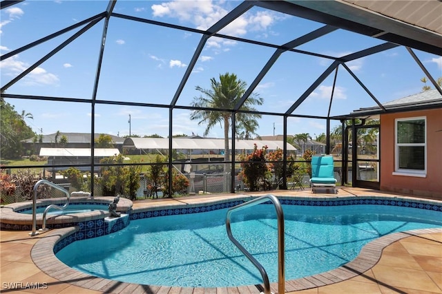 212 SE 30th Ter, Cape Coral, FL 33904 - view of pool featuring a pool with connected hot tub, glass enclosure, and a patio