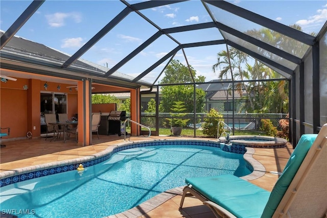 212 SE 30th Ter, Cape Coral, FL 33904 - view of pool featuring a patio, a pool with connected hot tub, area for grilling, outdoor dining space, and a lanai