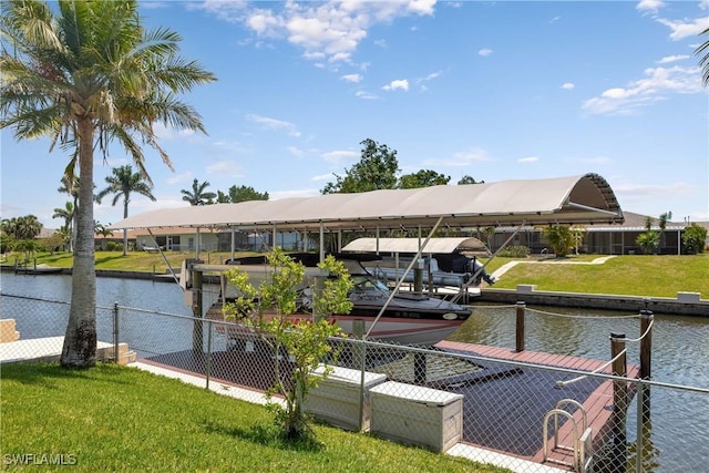 212 SE 30th Ter, Cape Coral, FL 33904 - dock area with a water view, a lawn, and boat lift