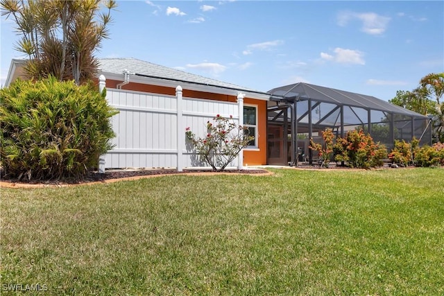 212 SE 30th Ter, Cape Coral, FL 33904 - view of grassy yard with glass enclosure