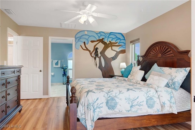 212 SE 30th Ter, Cape Coral, FL 33904 - bedroom with light wood-type flooring and a ceiling fan