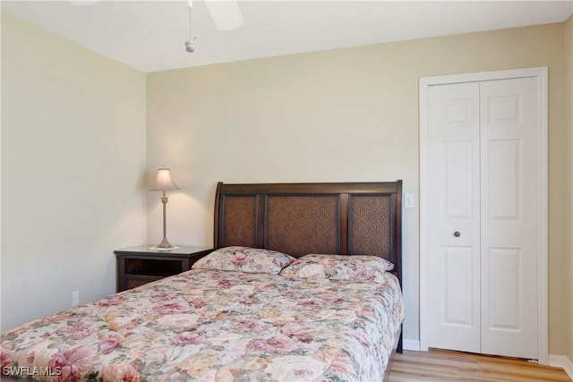 212 SE 30th Ter, Cape Coral, FL 33904 - bedroom with wood finished floors, a closet, and a ceiling fan