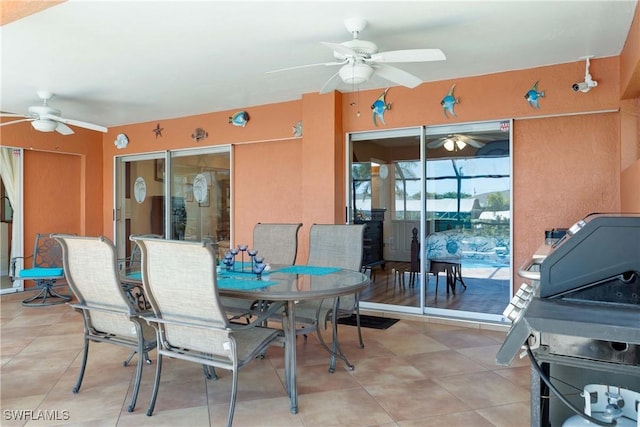212 SE 30th Ter, Cape Coral, FL 33904 - view of patio featuring a ceiling fan and outdoor dining area