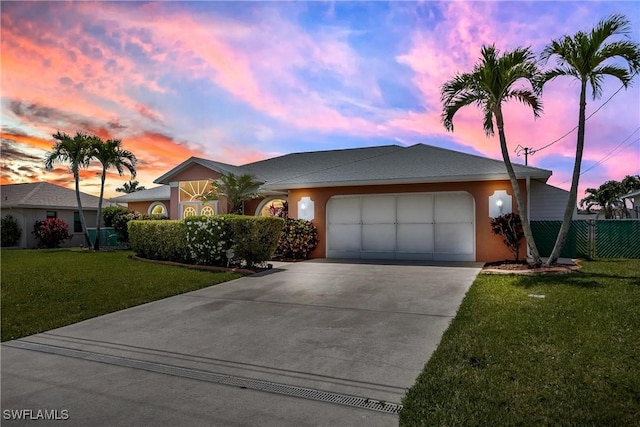 212 SE 30th Ter, Cape Coral, FL 33904 - ranch-style home featuring a garage, driveway, a front lawn, and stucco siding