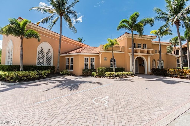 8617 River Homes Ln Unit 3108, Bonita Springs, FL 34135 - view of building exterior featuring uncovered parking