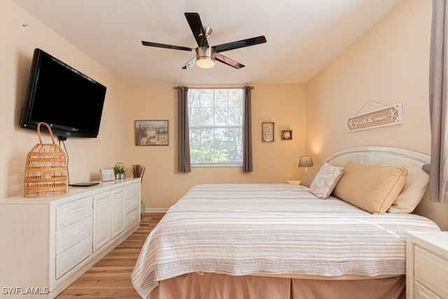 8617 River Homes Ln Unit 3108, Bonita Springs, FL 34135 - bedroom with light wood-style floors and a ceiling fan