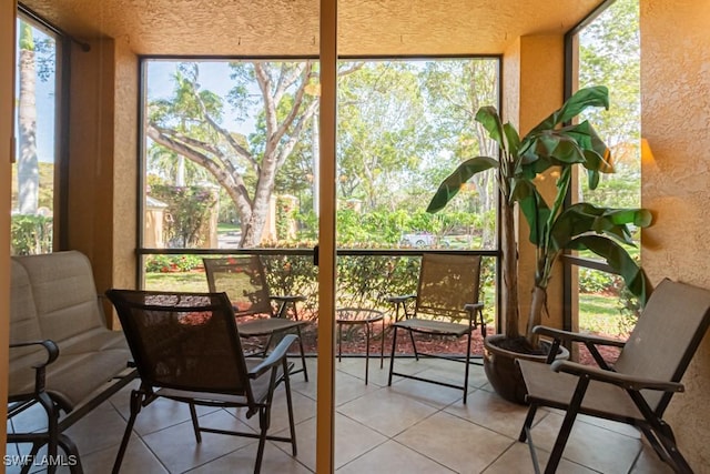 8617 River Homes Ln Unit 3108, Bonita Springs, FL 34135 - sunroom featuring a textured wall, tile patterned floors, and a textured ceiling