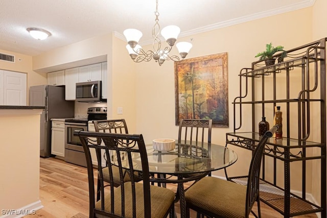 8617 River Homes Ln Unit 3108, Bonita Springs, FL 34135 - dining room featuring a chandelier, light wood finished floors, and ornamental molding