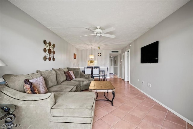 1624 Pine Valley Dr Unit 115, Fort Myers, FL 33907 - living room with light tile patterned flooring, a textured ceiling, baseboards, and ceiling fan