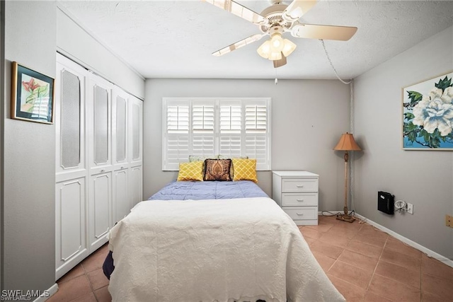 1624 Pine Valley Dr Unit 115, Fort Myers, FL 33907 - bedroom with a ceiling fan, baseboards, a closet, and light tile patterned floors