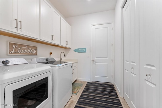 14071 Binghampton Dr, Fort Myers, FL 33905 - laundry room with washing machine and dryer, cabinet space, and light wood finished floors