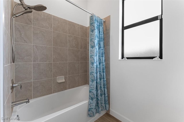 14071 Binghampton Dr, Fort Myers, FL 33905 - bathroom with shower / bath combo with shower curtain and baseboards