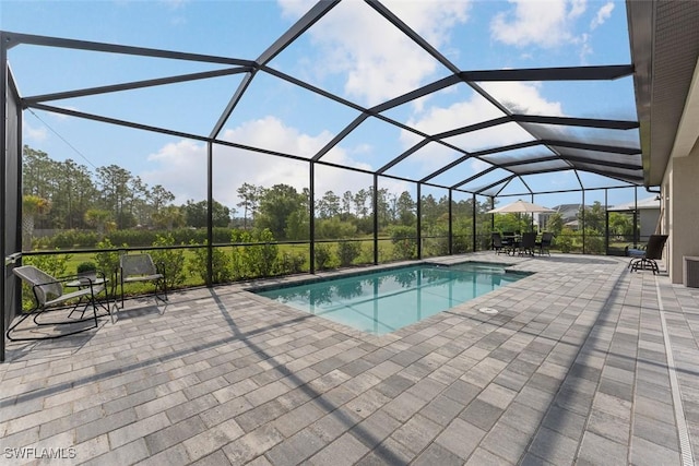 14071 Binghampton Dr, Fort Myers, FL 33905 - outdoor pool with a patio and glass enclosure