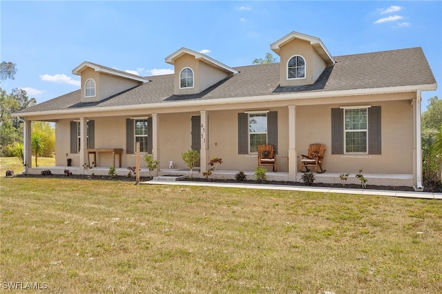 4551 Fort Center Ave, Fort Denaud, FL 33935 - view of front of home with stucco siding, a porch, and a front yard
