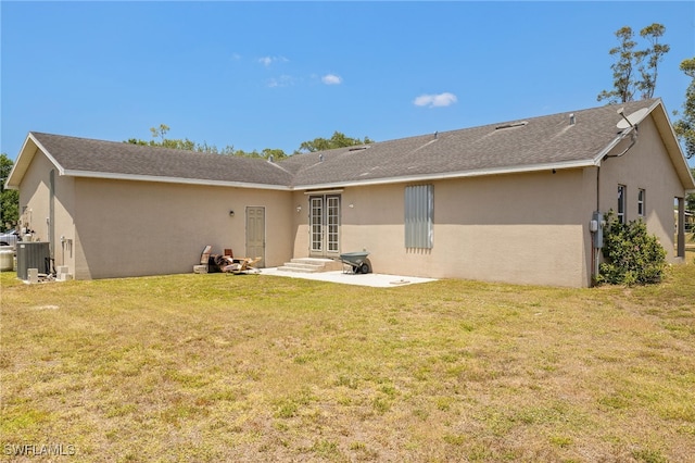 4551 Fort Center Ave, Fort Denaud, FL 33935 - back of property featuring a patio, a yard, and stucco siding