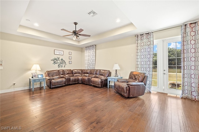4551 Fort Center Ave, Fort Denaud, FL 33935 - living room featuring a tray ceiling, wood finished floors, visible vents, and ceiling fan