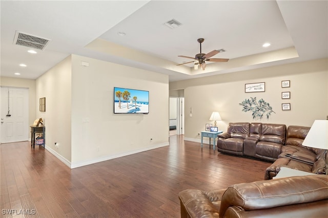 4551 Fort Center Ave, Fort Denaud, FL 33935 - living room with a tray ceiling, visible vents, dark wood-style floors, and ceiling fan
