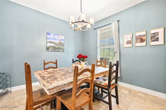4551 Fort Center Ave, Fort Denaud, FL 33935 - dining space with baseboards, stone finish flooring, and a chandelier