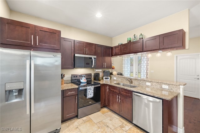 4551 Fort Center Ave, Fort Denaud, FL 33935 - kitchen with a peninsula, light stone counters, stainless steel appliances, and a sink