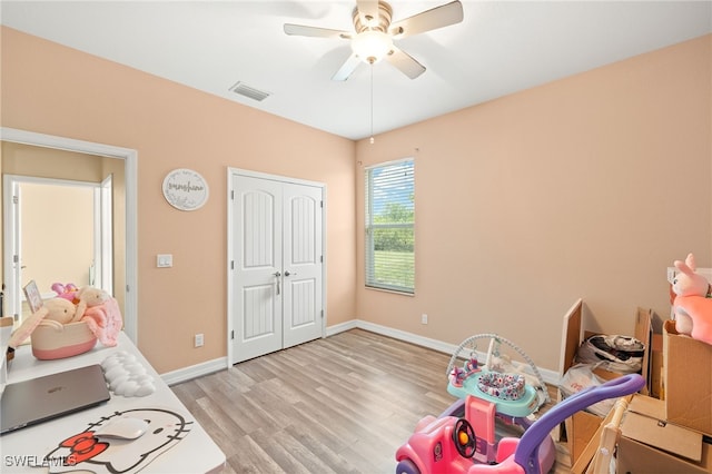 4551 Fort Center Ave, Fort Denaud, FL 33935 - playroom with light wood-style flooring, visible vents, a ceiling fan, and baseboards