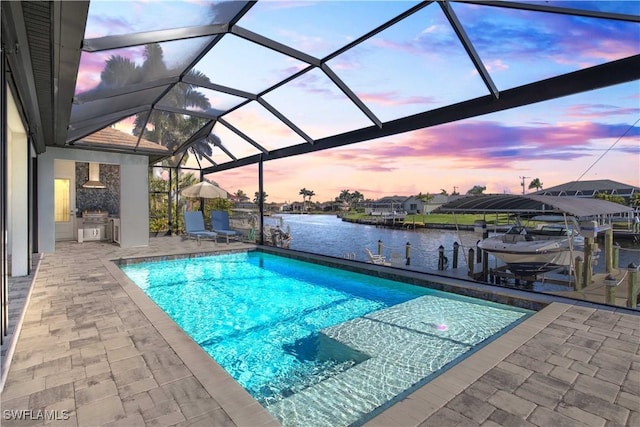 2008 SW 44th Ter, Cape Coral, FL 33914 - pool at dusk with boat lift, a dock, a patio, and an outdoor pool