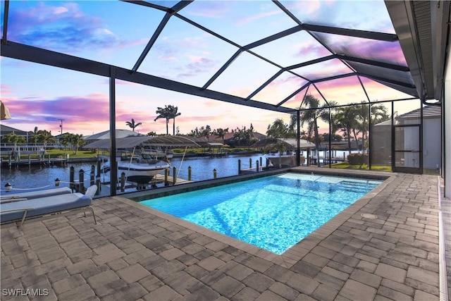 2008 SW 44th Ter, Cape Coral, FL 33914 - swimming pool with boat lift, a dock, a water view, and a patio area