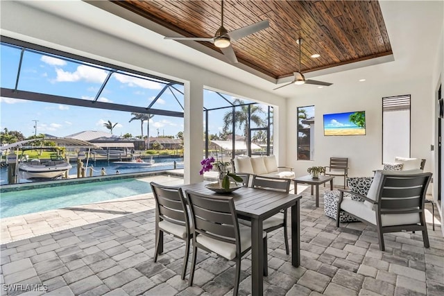 2008 SW 44th Ter, Cape Coral, FL 33914 - view of patio with boat lift, a ceiling fan, a dock, glass enclosure, and a water view