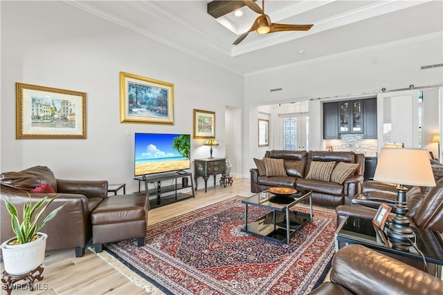 2008 SW 44th Ter, Cape Coral, FL 33914 - living area with light wood-style floors, a ceiling fan, and ornamental molding