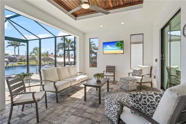 2008 SW 44th Ter, Cape Coral, FL 33914 - view of patio with an outdoor hangout area, a ceiling fan, glass enclosure, and a water view