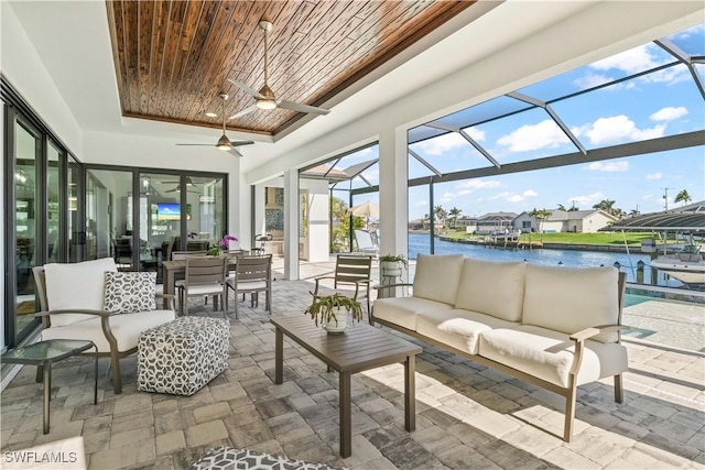 2008 SW 44th Ter, Cape Coral, FL 33914 - sunroom / solarium with ceiling fan, outdoor lounge area, and a water view