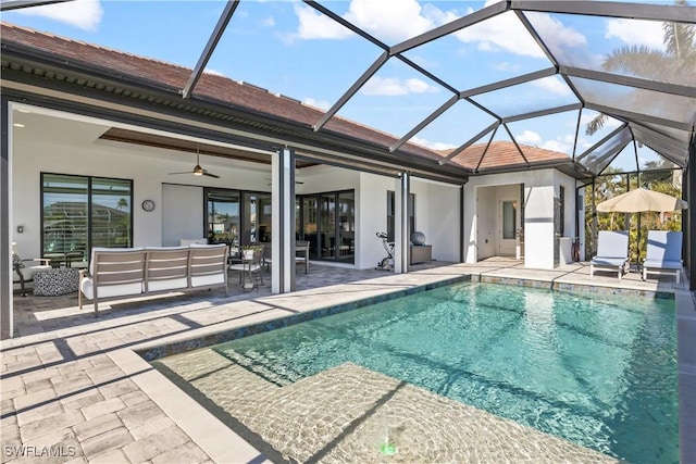 2008 SW 44th Ter, Cape Coral, FL 33914 - swimming pool with an outdoor hangout area, a patio, ceiling fan, and glass enclosure