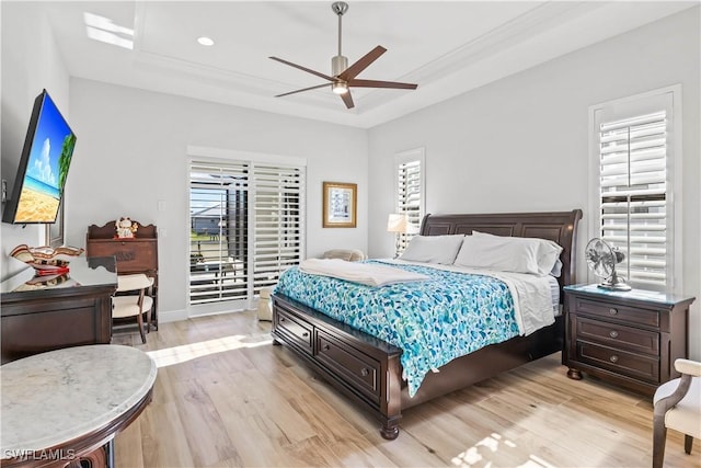 2008 SW 44th Ter, Cape Coral, FL 33914 - bedroom with a raised ceiling, light wood-style flooring, access to outside, and a ceiling fan