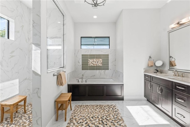 2008 SW 44th Ter, Cape Coral, FL 33914 - bathroom featuring marble tiled floors, a bath, vanity, and recessed lighting