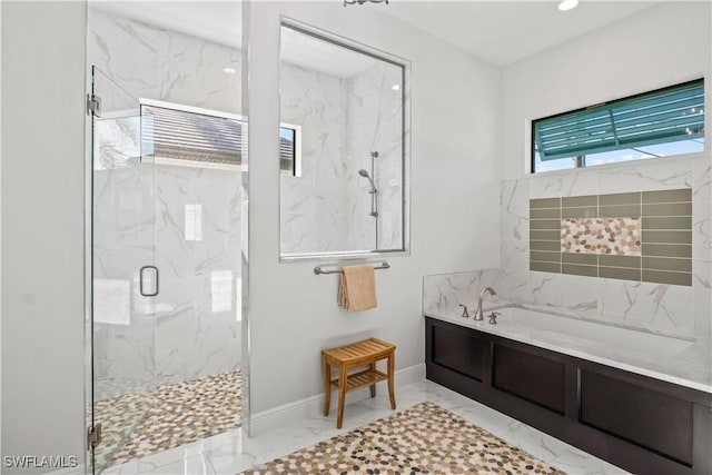 2008 SW 44th Ter, Cape Coral, FL 33914 - full bathroom with marble finish flooring, a marble finish shower, a bath, recessed lighting, and baseboards
