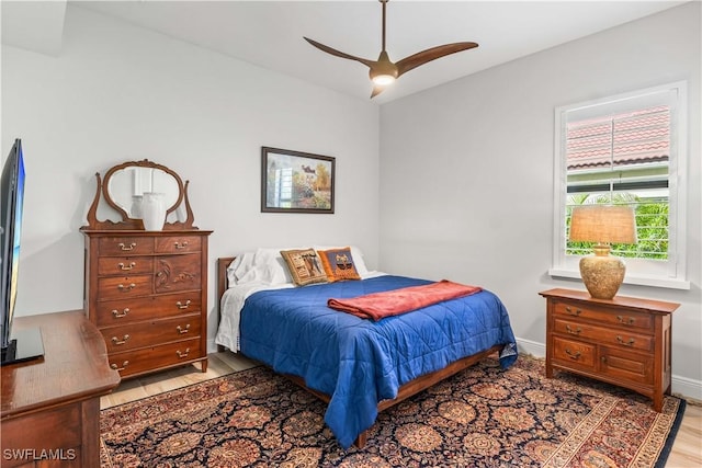 2008 SW 44th Ter, Cape Coral, FL 33914 - bedroom featuring light wood-style flooring, baseboards, and a ceiling fan