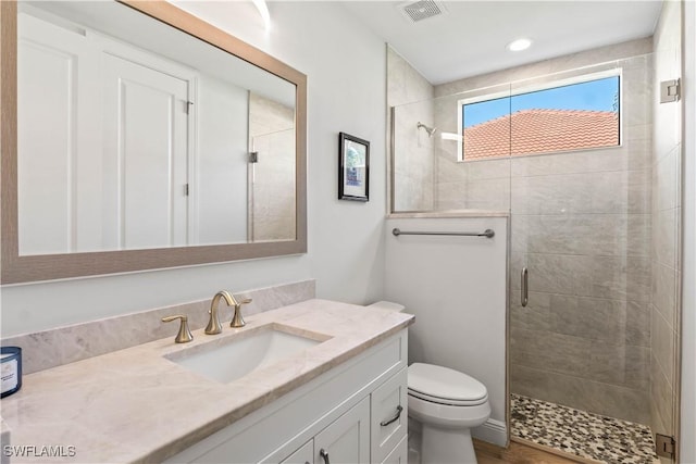 2008 SW 44th Ter, Cape Coral, FL 33914 - bathroom with vanity, a shower stall, toilet, and recessed lighting