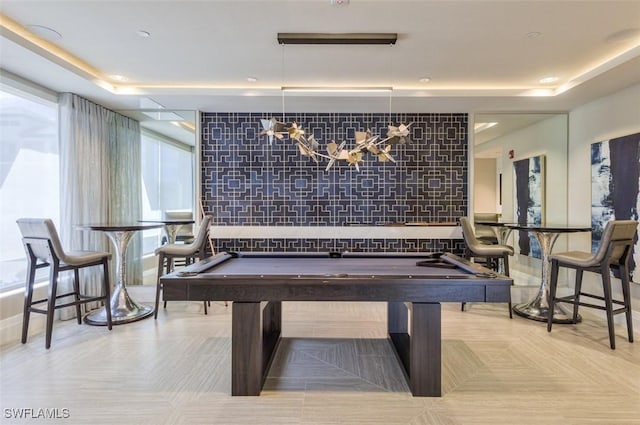rec room featuring a tray ceiling and pool table